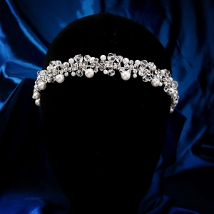 Detailed bridal headband featuring white pearls and crystals on silver vine structure