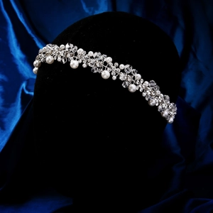Detailed close-up of handmade bridal headband with white pearls and clear crystal beads