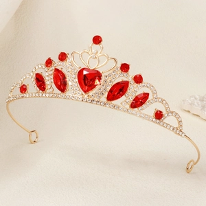 Detail of golden heart tiara headband with red and clear rhinestones for weddings
