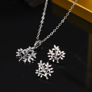 Macro detail of vintage tree design necklace and earrings set with micro-pave zircons