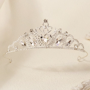 Macro detail of silver heart crown tiara with sparkling crystal rhinestones