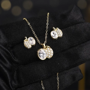 Detailed close-up of a luxury gold zircon jewelry set with necklace and earrings