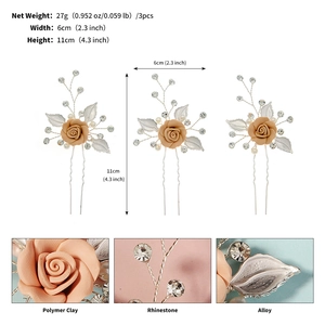 Detailed specs of floral hair pins set with polymer clay roses and silver leaf accents