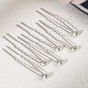 Detail of 7pcs silver U-shaped hair pins with sparkling rhinestones for bridal styling