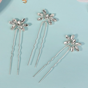 Detail of silver U-shaped hair pins with marquise-cut rhinestones in floral design