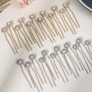 Close-up of 20pcs sparkling floral rhinestone U-shaped hair pins in gold and silver finish