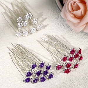 Detail of crystal rhinestone rose hair pins in silver, purple, and red for bridal updos
