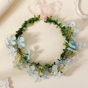 Floral wreath headband with light blue silk flowers and pink ribbon for weddings