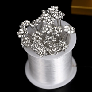 Close-up of sparkling rhinestone flower hair pins for elegant bridal and wedding hairstyles