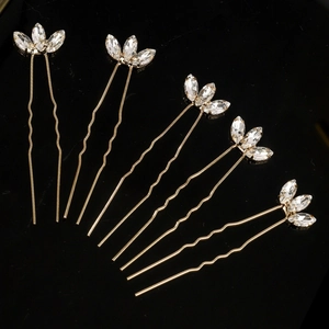 Set of five gold U-shaped bridal hair pins with leaf-shaped sparkling crystals