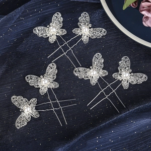 Detail of 5-piece silver butterfly hair pins with sparkling rhinestones and pearls