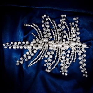 Elegant bridal hairband with handmade pearls and sparkling rhinestones on blue silk