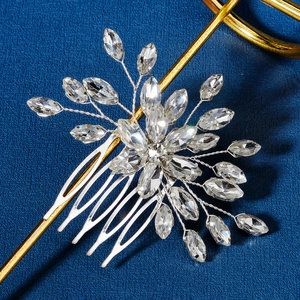 Macro shot of handcrafted silver bridal hair comb with marquise cut crystals