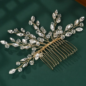 Detail of handmade gold wire bridal hair comb featuring sparkling crystal branch motifs