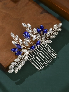 Detail of handcrafted silver hair comb with navy blue and clear rhinestones for brides