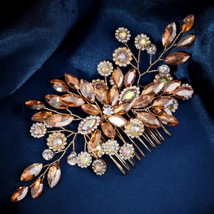Detail of luxury bridal hair comb with gold wire, marquise crystals and sparkling rhinestones