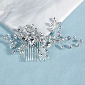 Detailed macro view of the sparkling crystal bridal hair comb on marble surface