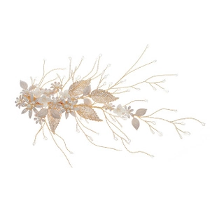 Detailed macro view of handmade bridal hair comb with gold leaves and white ceramic flowers