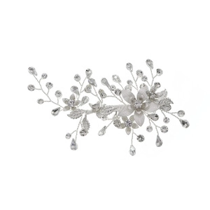 Detail view of silver floral hair clip with crystal rhinestones and vine design