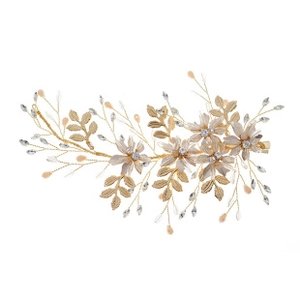 Detail of handmade champagne gold flower hair clip with crystal beads and metal leaves