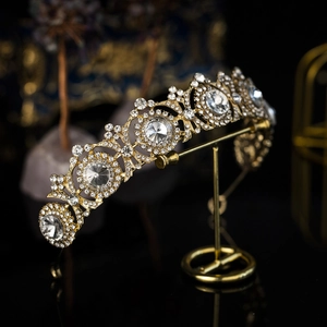 Detailed macro view of vintage golden alloy bridal tiara with sparkling crystal rhinestones