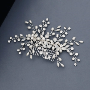 Detail view of handcrafted bridal hair comb with pearls and rhinestones on silver wire