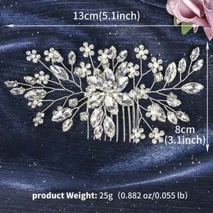 Detailed view of handmade bridal hair comb with silver leaf design and white pearls