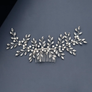 Detailed close-up of handmade bridal hair comb with silver wire and sparkling rhinestones