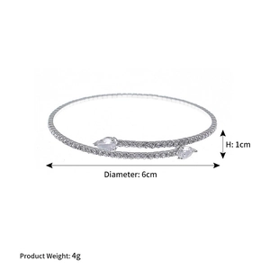 Detailed view of silver bypass bracelet featuring pave rhinestones and pear-cut diamonds