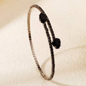 Detail of black rhinestone cuff bracelet with pear-shaped stones and pavé setting