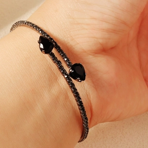 Sparkling silver bangle with black teardrop crystals and pave-set rhinestones