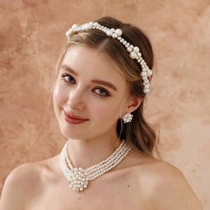 Elegant bridal set featuring handmade pearl headband, necklace and matching earrings