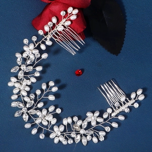 Detail showing handmade bridal headband with white pearls, crystals and hair comb attachment