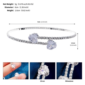 Macro detail of silver heart bracelet with cubic zirconia and dimensions labeled