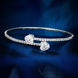Close-up of sparkling silver double heart open cuff bracelet with pavé rhinestones