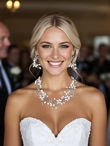 Detail of bridal jewelry set with pearls and rhinestones worn by a model