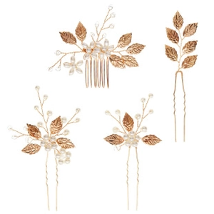 Detail of bridal hair set with gold metal leaves and white pearls for weddings