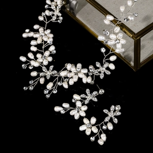 Elegant bridal jewelry set with white pearl vine hair band and matching drop earrings