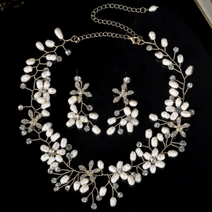 Detailed view of handmade pearl necklace and earrings set with crystal rhinestones