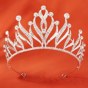Macro detail of silver baroque crown showing intricate alloy frame and sparkling rhinestones