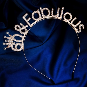 Detail of 60 and Fabulous headband with gold rhinestones and crown for 60th birthday party