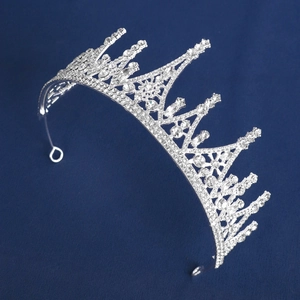Macro detail of luxury silver crystal bridal crown with intricate snowflake patterns