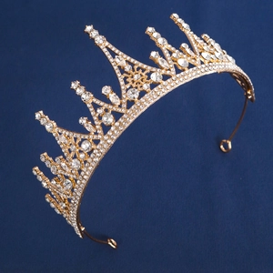 Detailed side view of luxury gold crystal crown with sparkling rhinestones for bridal weddings