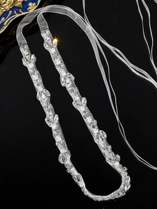 Detailed view of handmade bridal belt with marquise rhinestones and pearls on mesh