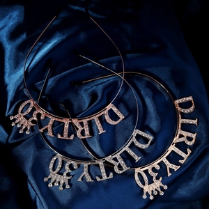 Detail view of Dirty 30 birthday headbands with rhinestones and crown accents