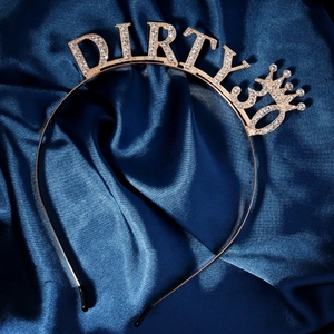 Macro shot of Dirty 30 rose gold headband with sparkling crystals and small crown detail