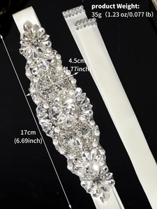 Close-up of bridal belt with rhinestones and pearls detailing 17cm by 4.5cm size