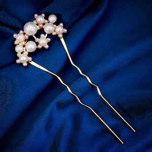 Elegant gold U-shape hair pin with white pearls on dark blue pleated silk fabric