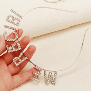 Detailed view of silver Birthday Girl headband featuring sparkling rhinestones and metal alloy