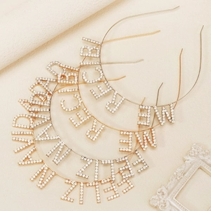 Sparkling rhinestone festive headbands featuring Feliz Navidad and Merry Christmas lettering